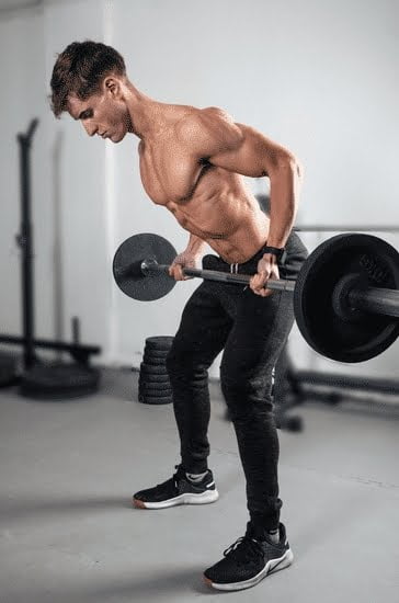 What Is the Snap Fitness Evolution Challenge Snap Fitness Evolution Challenge logo featuring fitness icon embracing a bustling gym atmosphere with enthusiastic participants