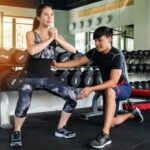 Close-up of woman tracking iPhone fitness goals on her smartphone