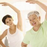 A visual representation of a person lifting heavy weights in a fitness gym demonstrating the concept of overloading in fitness training