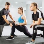 Fitness enthusiast reading a motivational guide on how to stay motivated in their workout routine