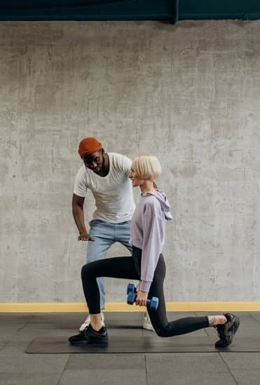 Fitness trainer demonstrating exercises to a group, explaining the importance of licensing