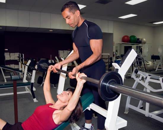 How to Hit Fitness Goals 1 Image: How to Hit Fitness Goals - A person lifting weights at the gym