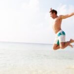 Fitness model doing weighted strength training routine to build lean muscle and improve overall health