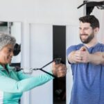 Fitness Blender Feel Good Stretching Routine Fitness Blender Feel Good Stretching Routine: Relaxed woman stretching in a sunny gym