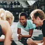 Professional cricket players engaging in a rigorous fitness routine to improve performance and endurance