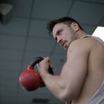 Fitness routine gym featuring strength training, cardiovascular exercises, and flexibility workouts for overall wellness