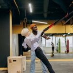 Image: Person feeling dejected in workout clothes, representing the struggle of loss of fitness motivation