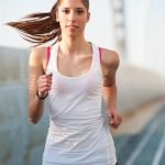 Samsung Gear Fit 2 Morning Exercise Suggestion: SAMSUNG GEAR FIT 2 MORNING EXERCISE: A person wearing the Gear Fit 2 while working out at sunrise